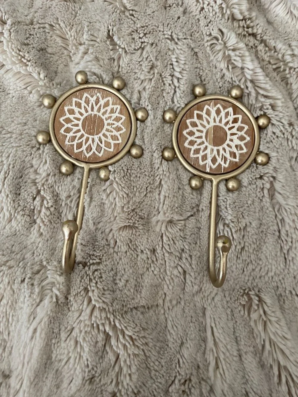 Wild Sage sunflower gold-toned decorative wall hooks with a carved wood accent